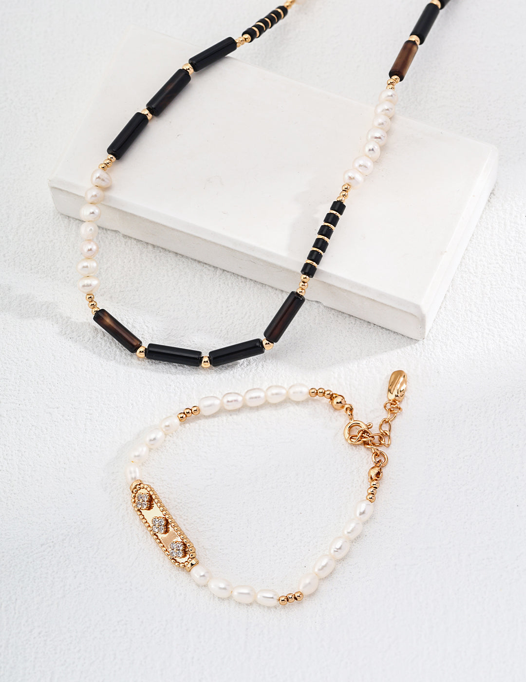 Mystic Noir Pearl & Onyx Necklace featuring luminous pearls and striking black onyx beads, elegantly designed for versatile styling.