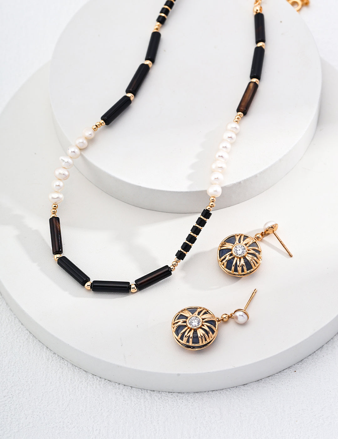 Mystic Noir Pearl & Onyx Necklace featuring luminous pearls and striking black onyx beads, elegantly designed for versatile styling.