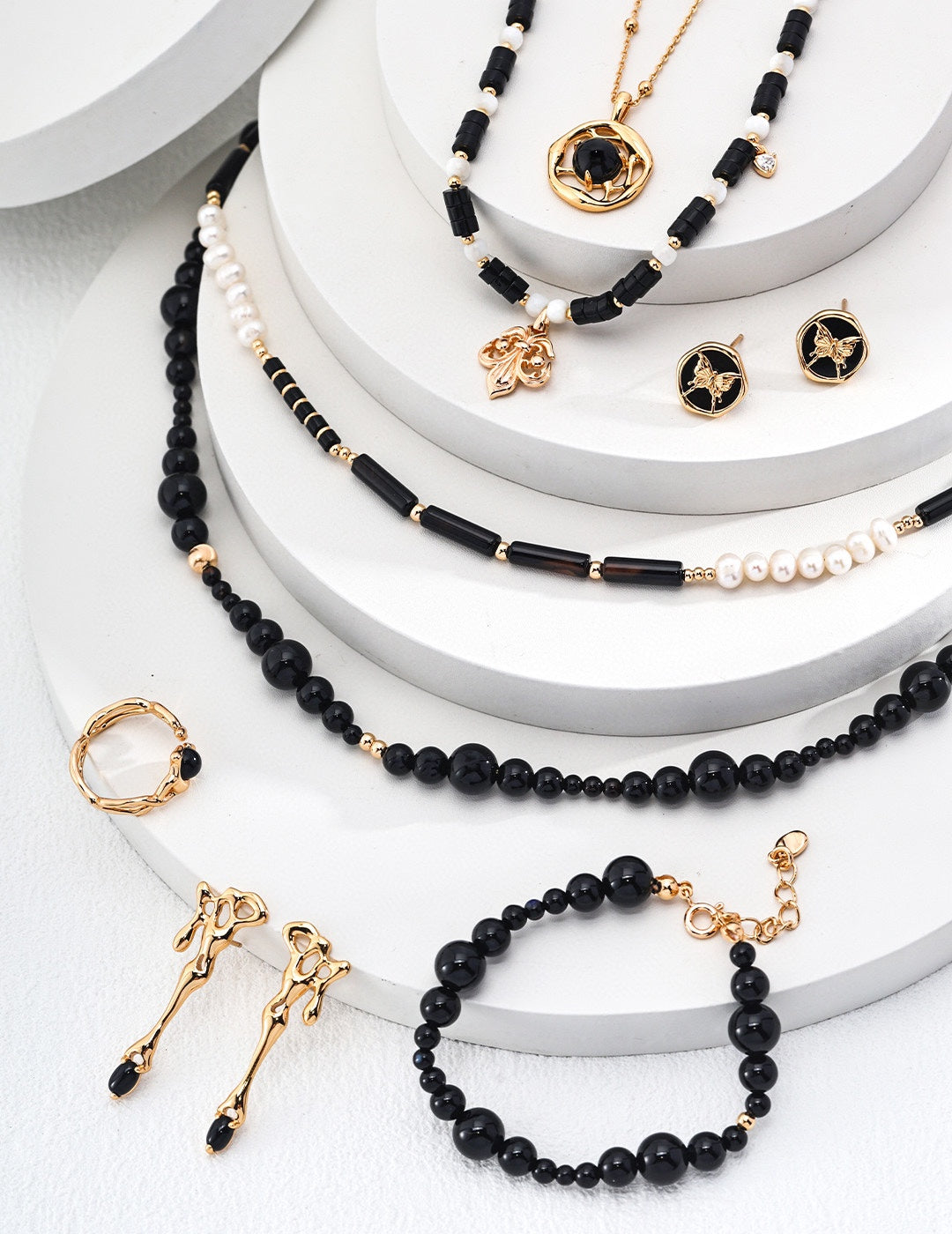 Mystic Noir Pearl & Onyx Necklace featuring luminous pearls and striking black onyx beads, elegantly designed for versatile styling.