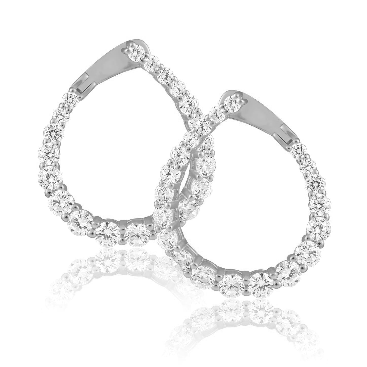 Naomi Cz Earring featuring a tilted teardrop shape adorned with sparkling cz stones and 18k gold plating.