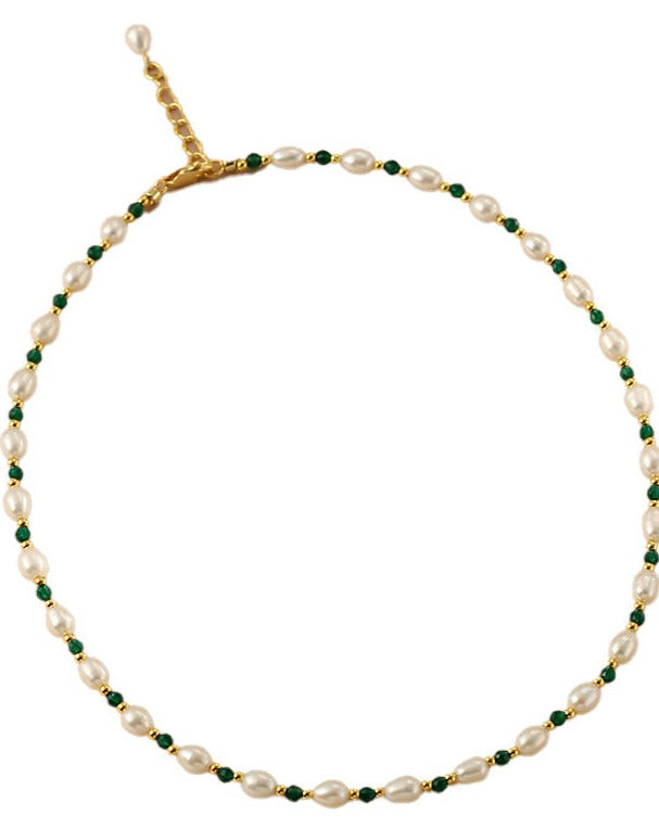 Natural Freshwater Pearl Bracelet featuring green gemstone accents, showcasing elegant design and luxurious craftsmanship.