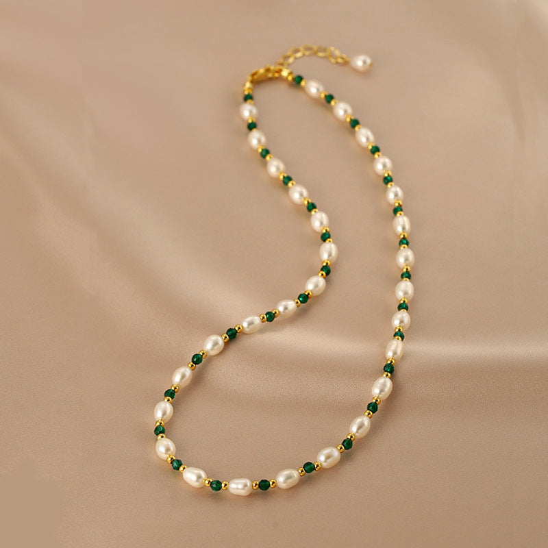 Natural Freshwater Pearl Bracelet featuring green gemstone accents, showcasing elegant design and luxurious craftsmanship.