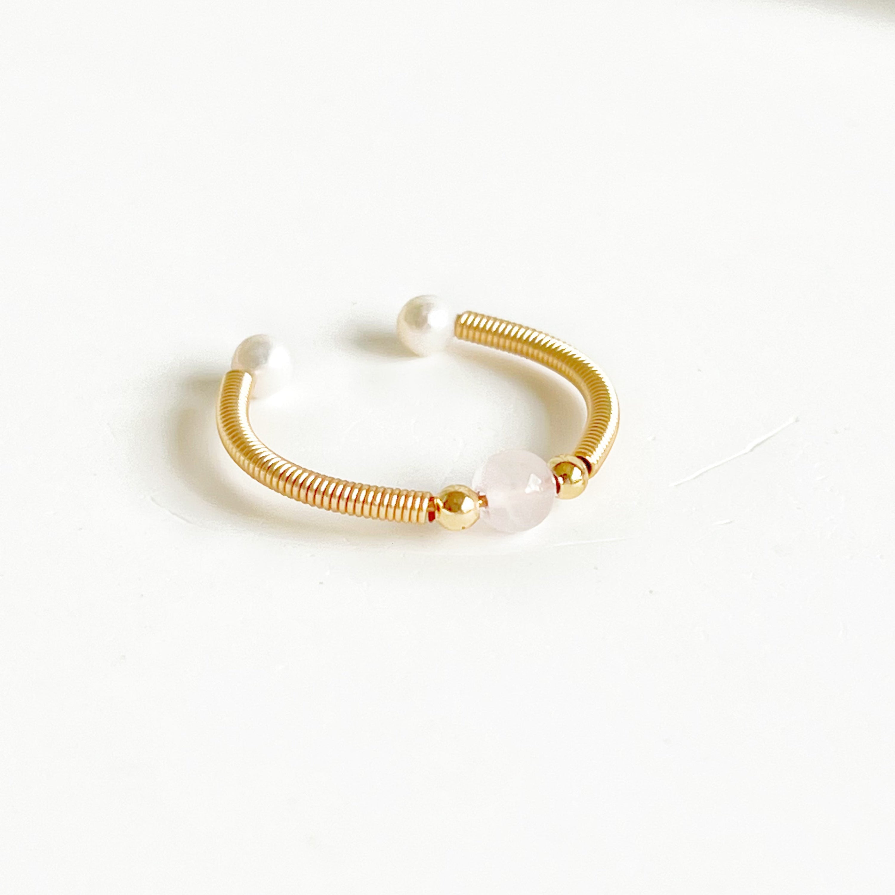 Natural Rose Quartz Bead Adjustable Ring featuring a 4mm pink crystal bead on gold-plated bronze wire, elegantly handcrafted.