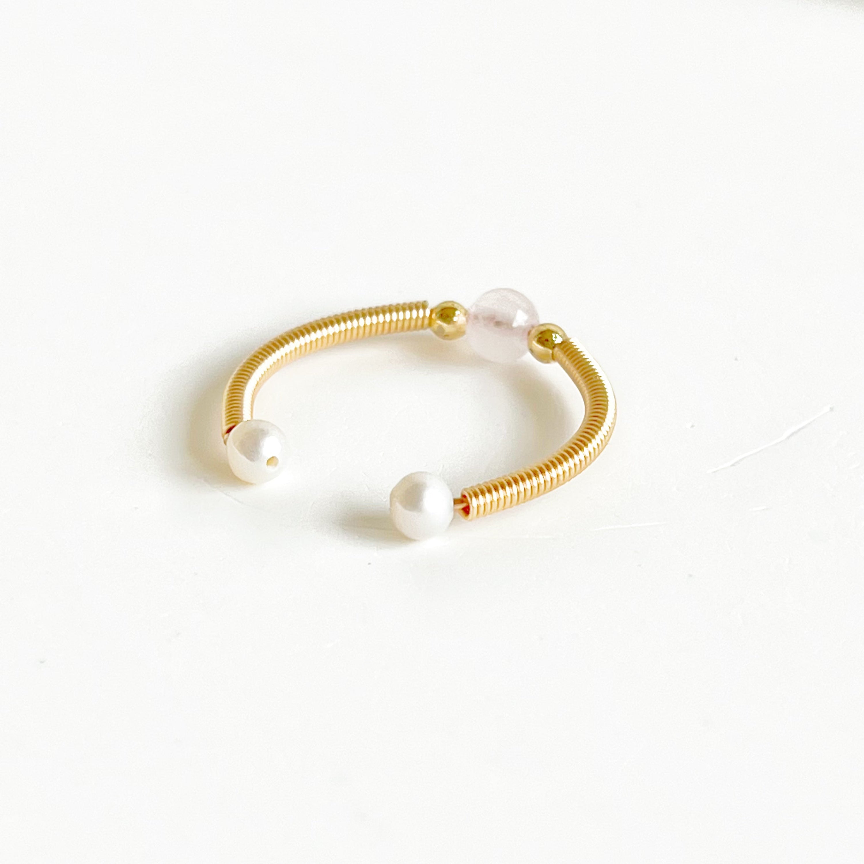 Natural Rose Quartz Bead Adjustable Ring featuring a 4mm pink crystal bead on gold-plated bronze wire, elegantly handcrafted.