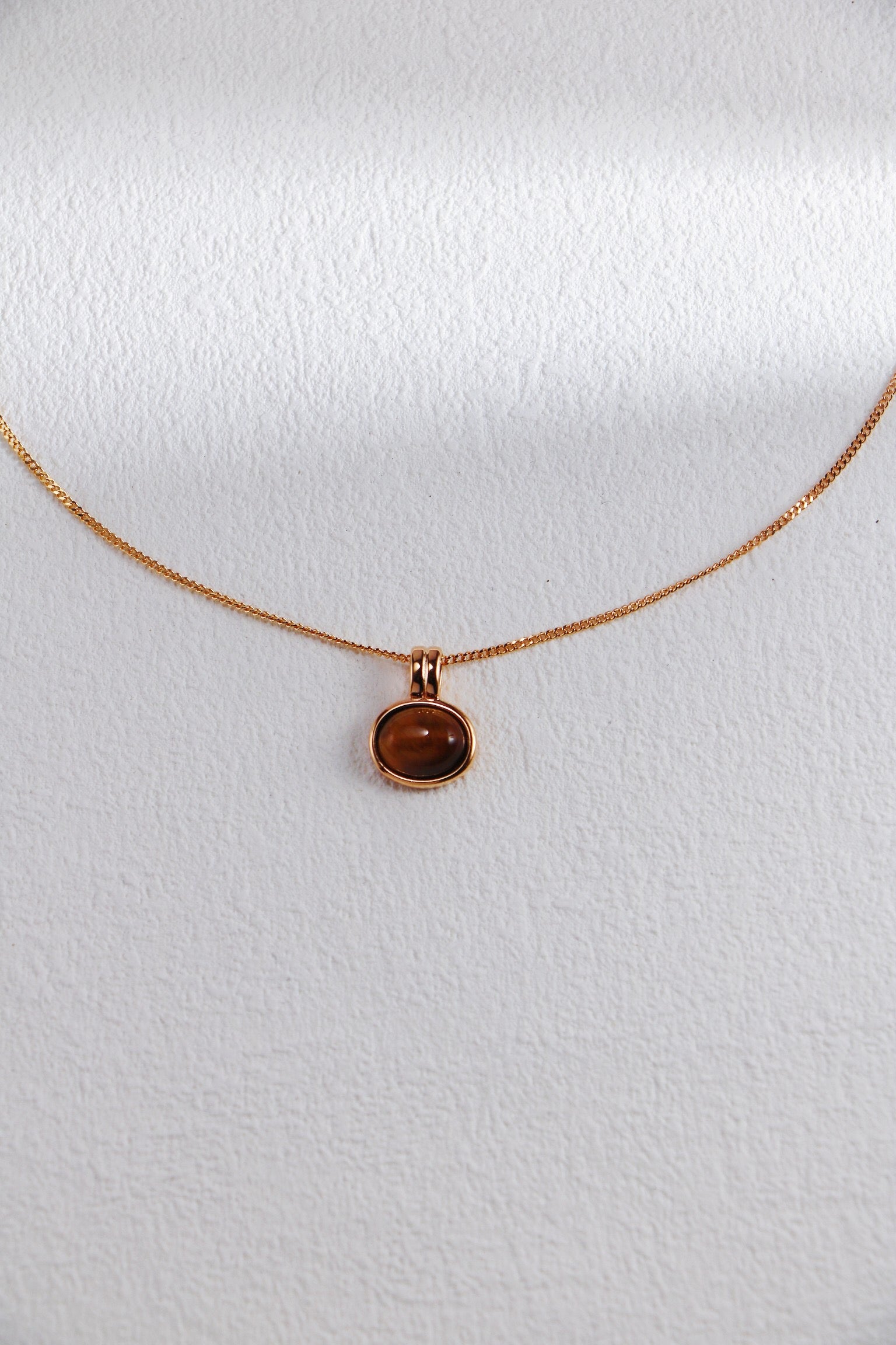 Natural Tiger Eye Stone and Red Agate Necklace featuring gold vermeil accents, showcasing its unique stones and elegant design.