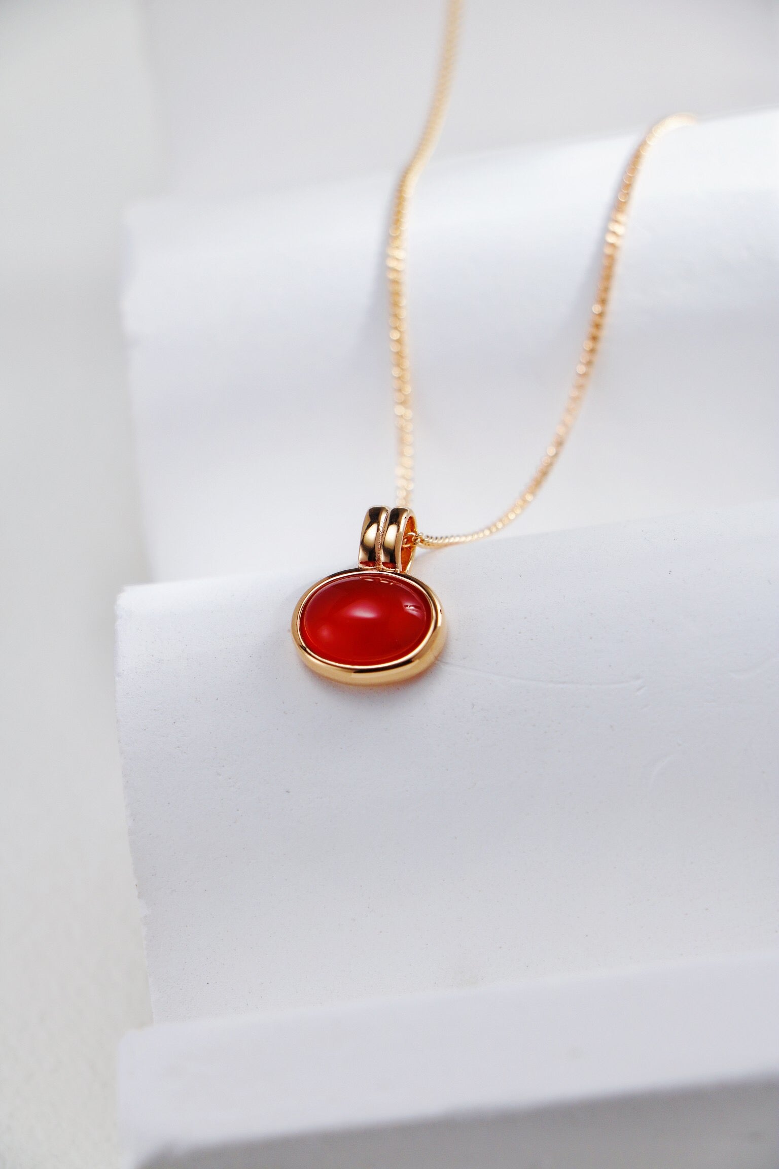 Natural Tiger Eye Stone and Red Agate Necklace featuring gold vermeil accents, showcasing its unique stones and elegant design.
