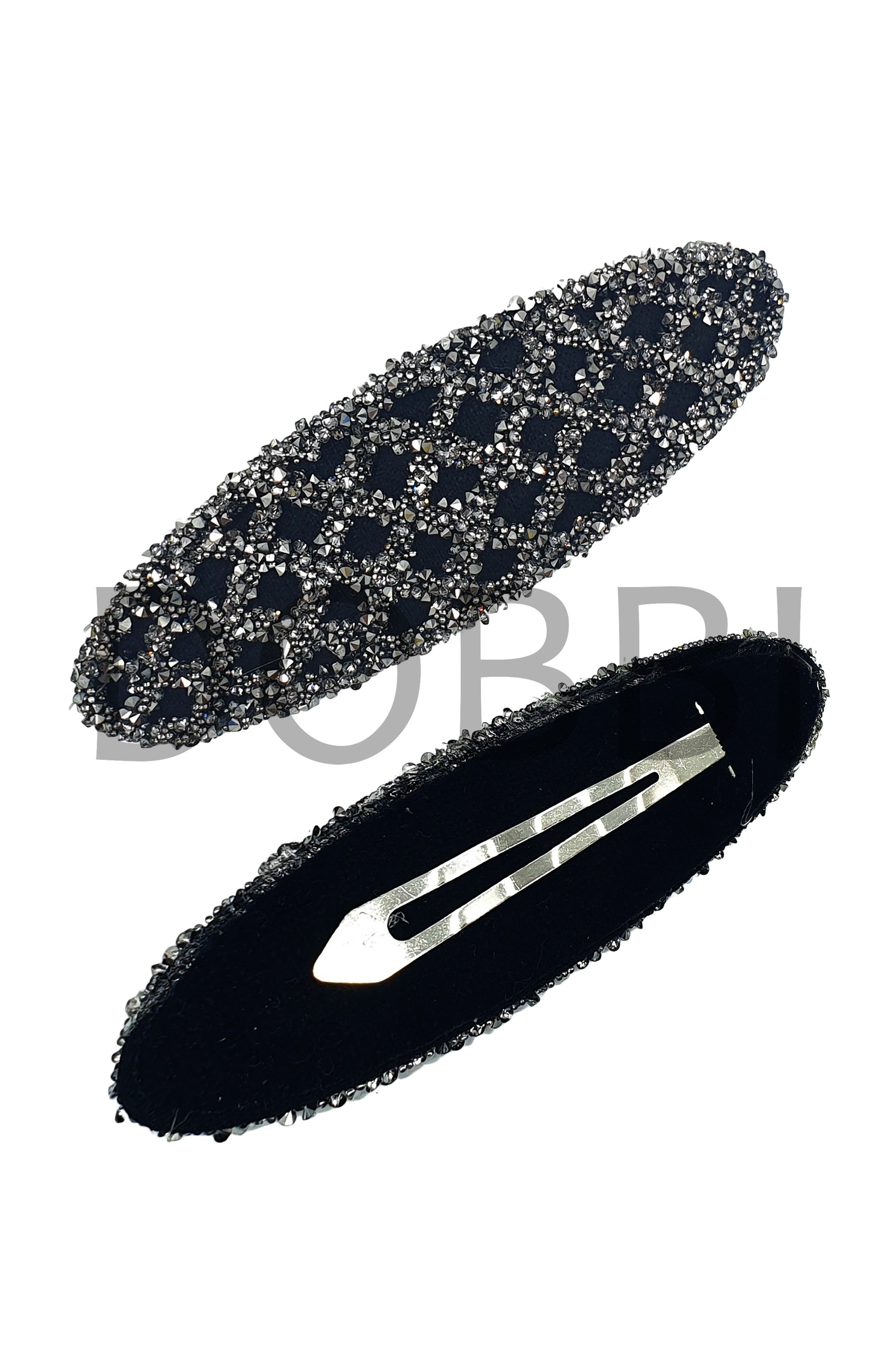 Stylish net lined cubic hair clips made of plastic and artificial marble, showcasing a modern design.
