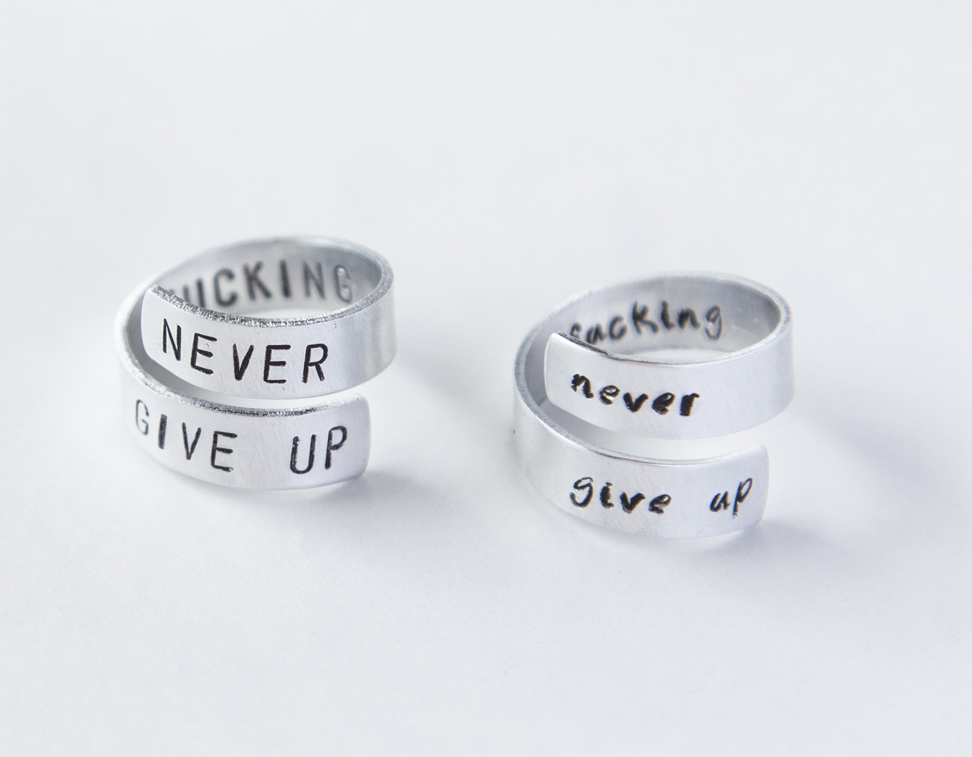Never Fucking Give Up Ring, adjustable aluminum ring with hand-stamped letters, symbolizing cancer survival and victory.