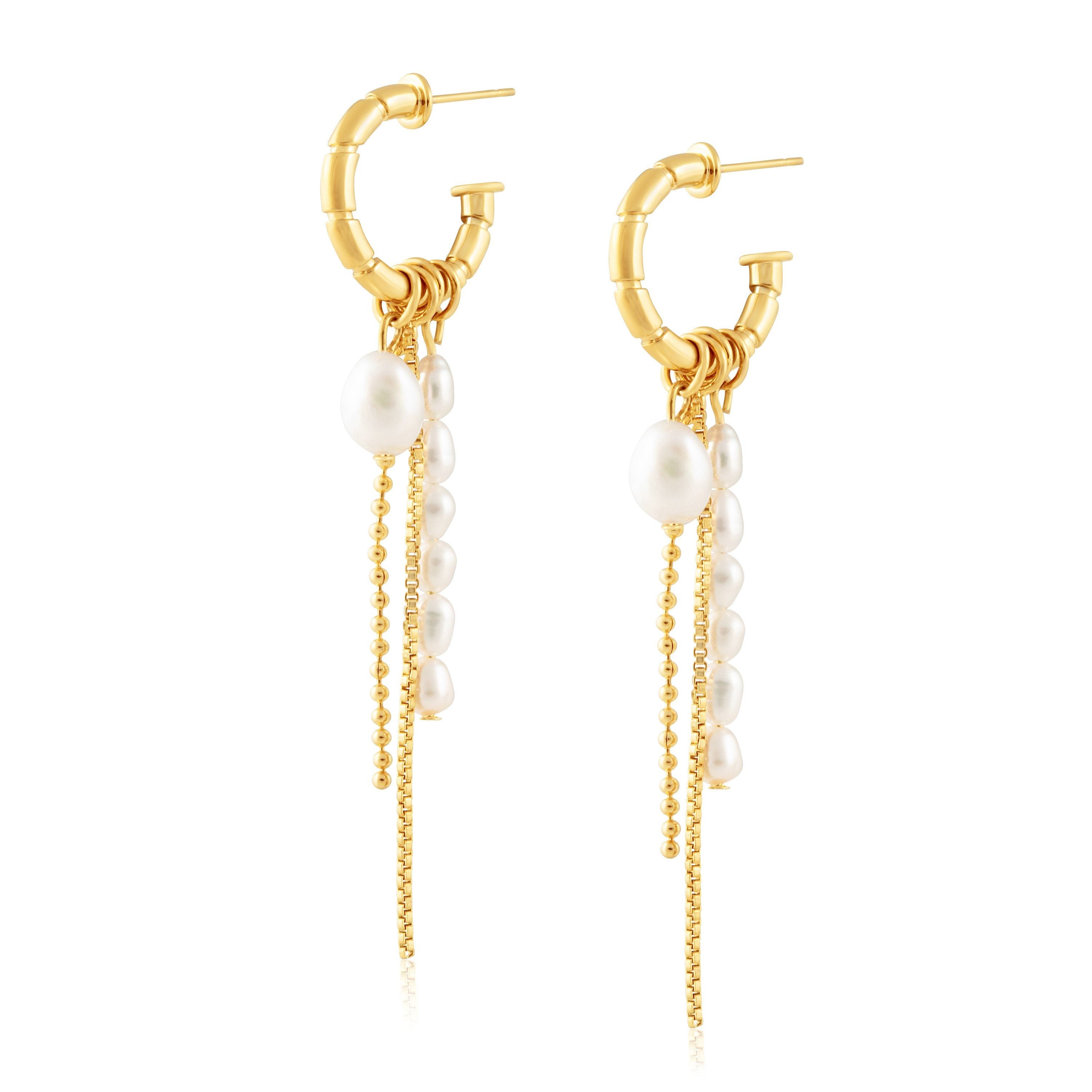 Nisea Earrings featuring 18k gold plated stainless steel hoops with a chain drop, elegantly designed for a bold yet feminine look.