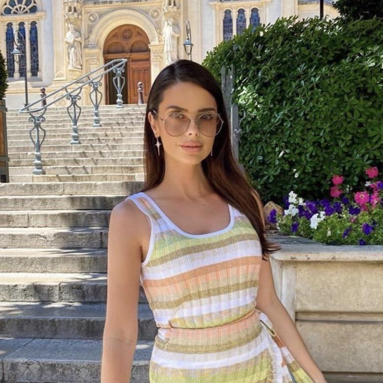 North Star Burst Large Drop Earrings in Gold featuring a star burst design with white zirconia, crafted from sterling silver and gold.