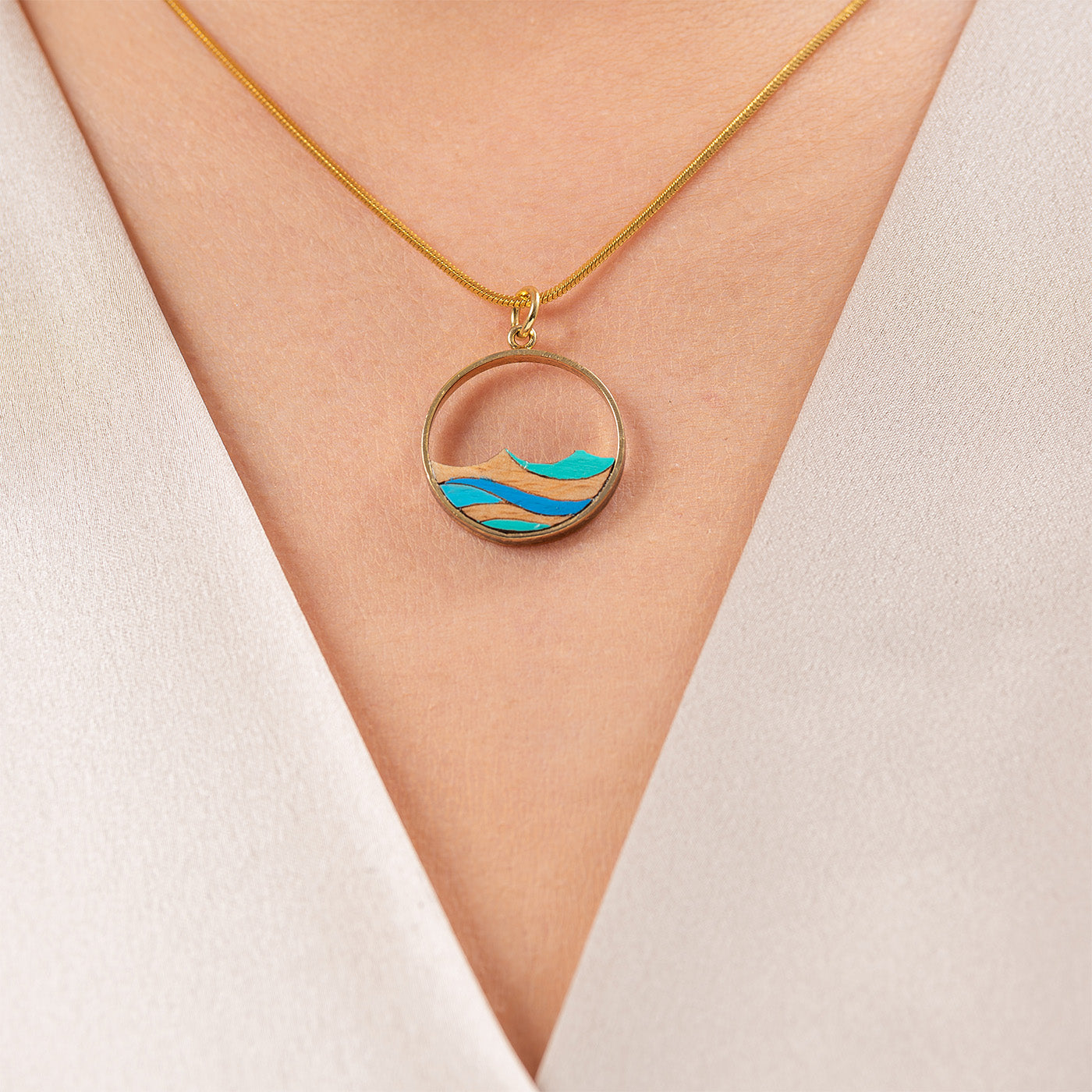 Ocean Recycled Wood Gold Necklace featuring a unique wooden pendant and 24K gold plated chain, elegantly displayed in a luxury gift box.