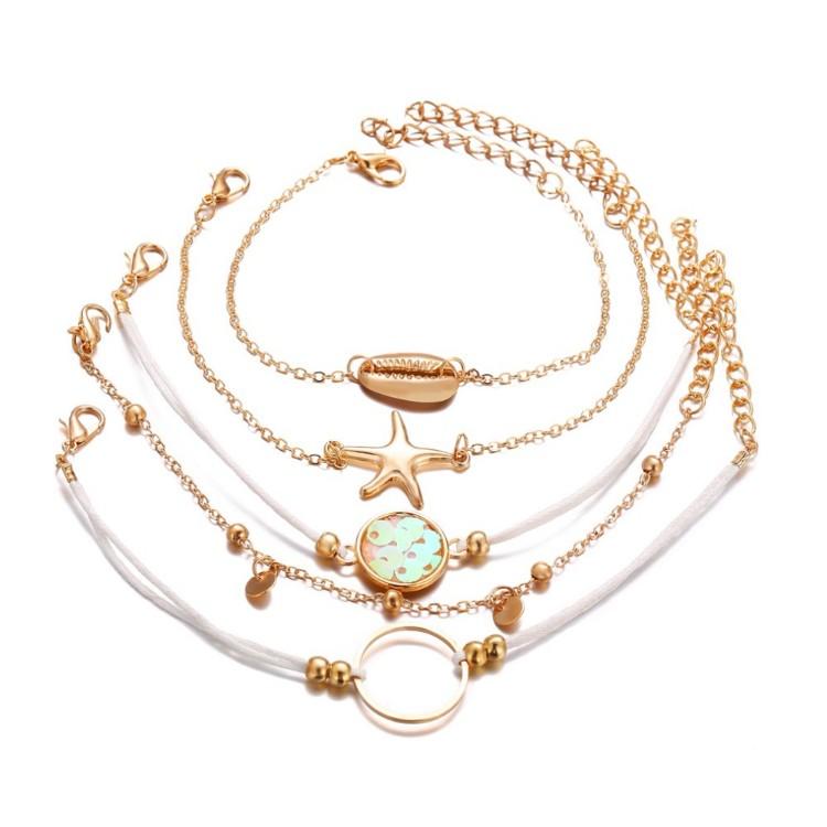 Oceanic Inspired Seashell 5 Piece Bracelet Set featuring 14K gold plating and a seashell pendant, elegantly designed in Italy.