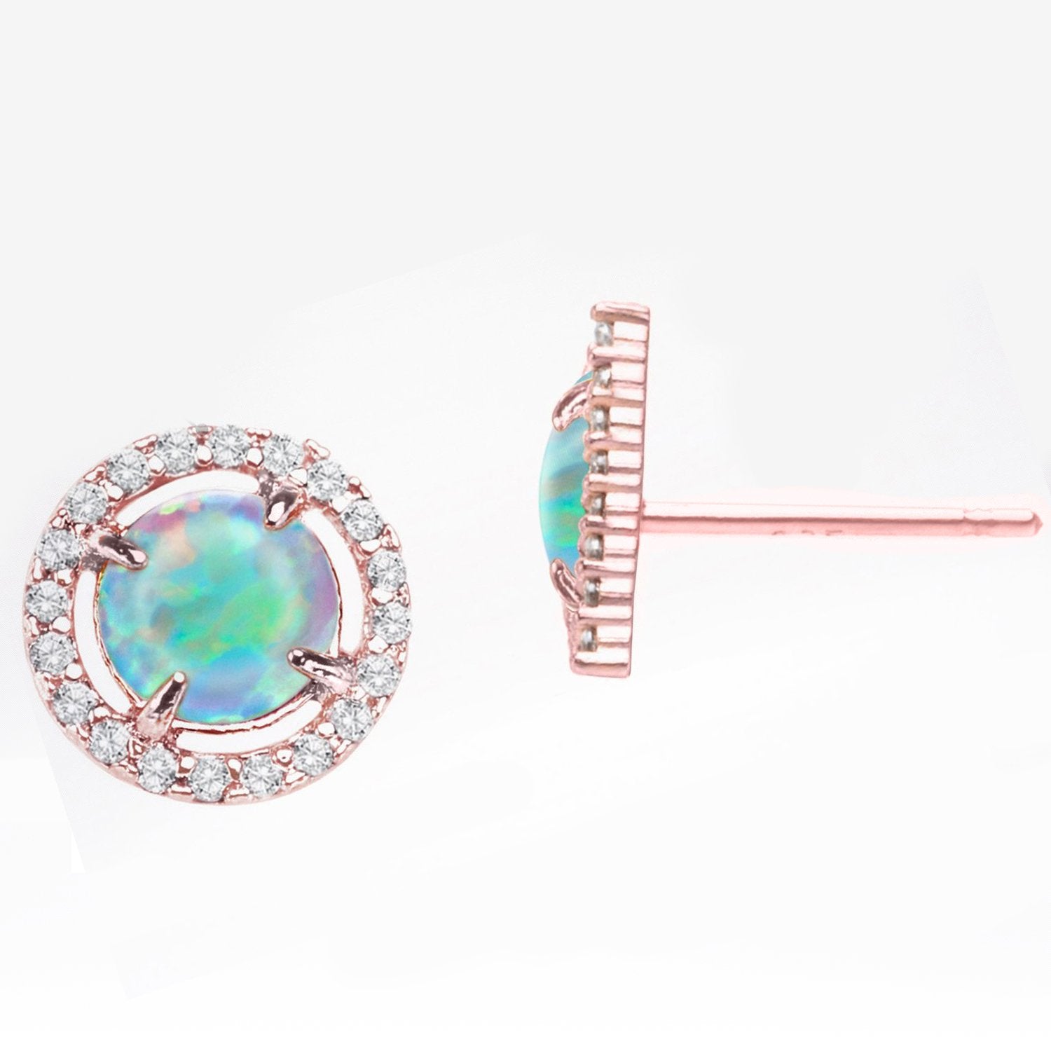 Elegant Oceanic Opal Blue Studs in 14K Rose Gold, featuring vibrant blue opal stones set in a stylish martini stud design.