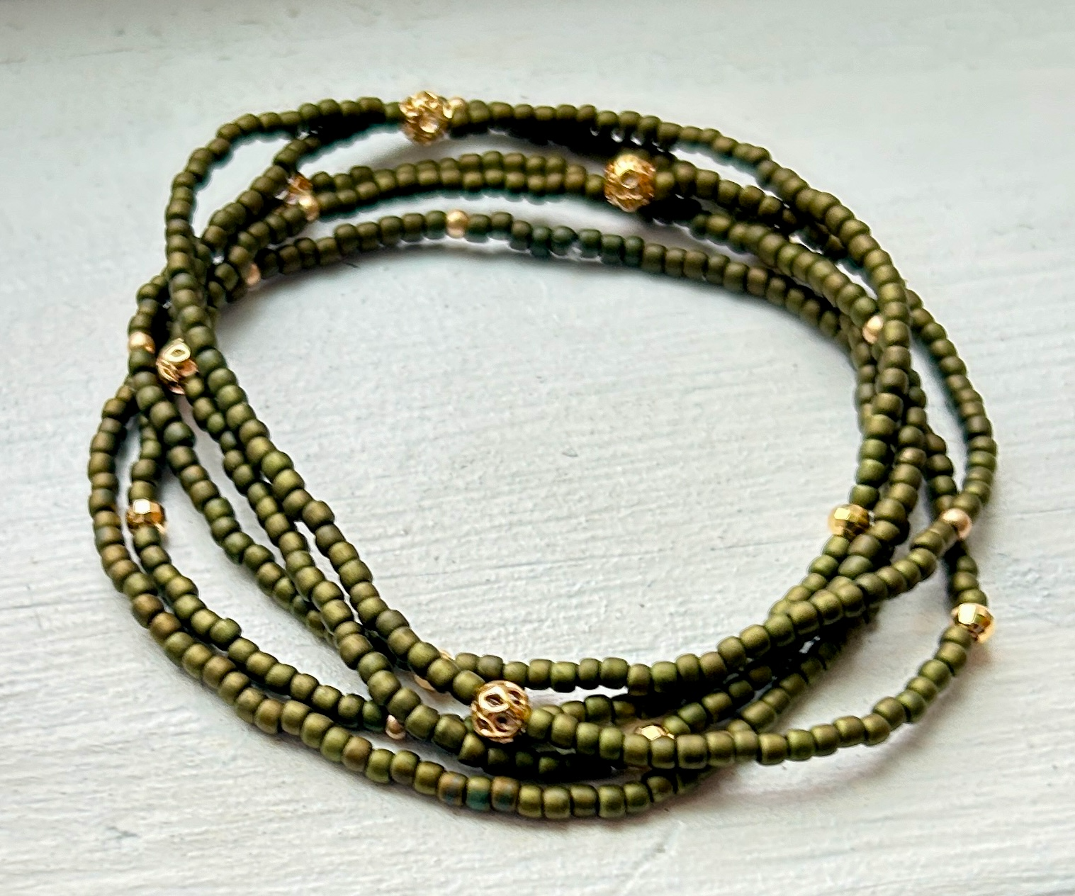 Olive green and gold or silver sprinkled beaded boho wrap bracelet, showcasing Czech glass seed beads and metallic accents.