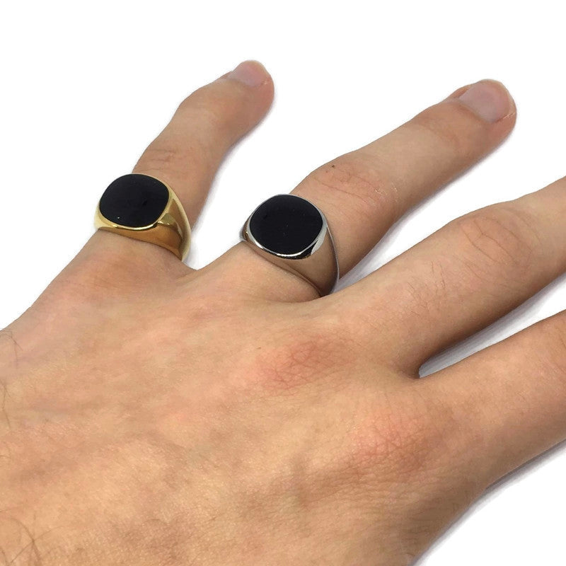 Onyx-Style Black Stone Ring made of stainless steel, featuring a sleek black stone centerpiece and a modern design suitable for all genders.