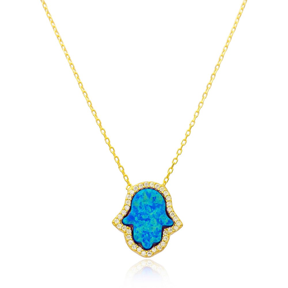 A beautiful OPAL Hamsa Necklace featuring an oceanic blue opal surrounded by sparkling cubic zirconias, crafted in 925 sterling silver with yellow gold plating.