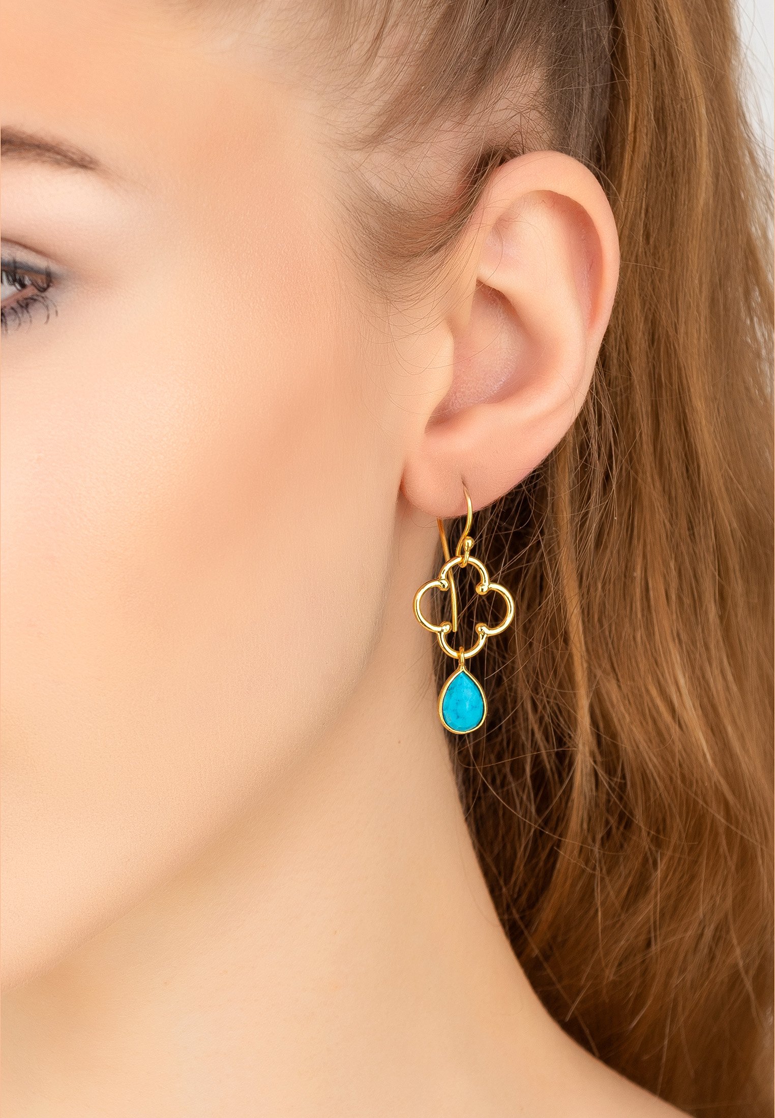 Open Clover Gemstone Drop Earrings featuring turquoise gemstone and 22ct gold accents, elegantly designed for statement wear.
