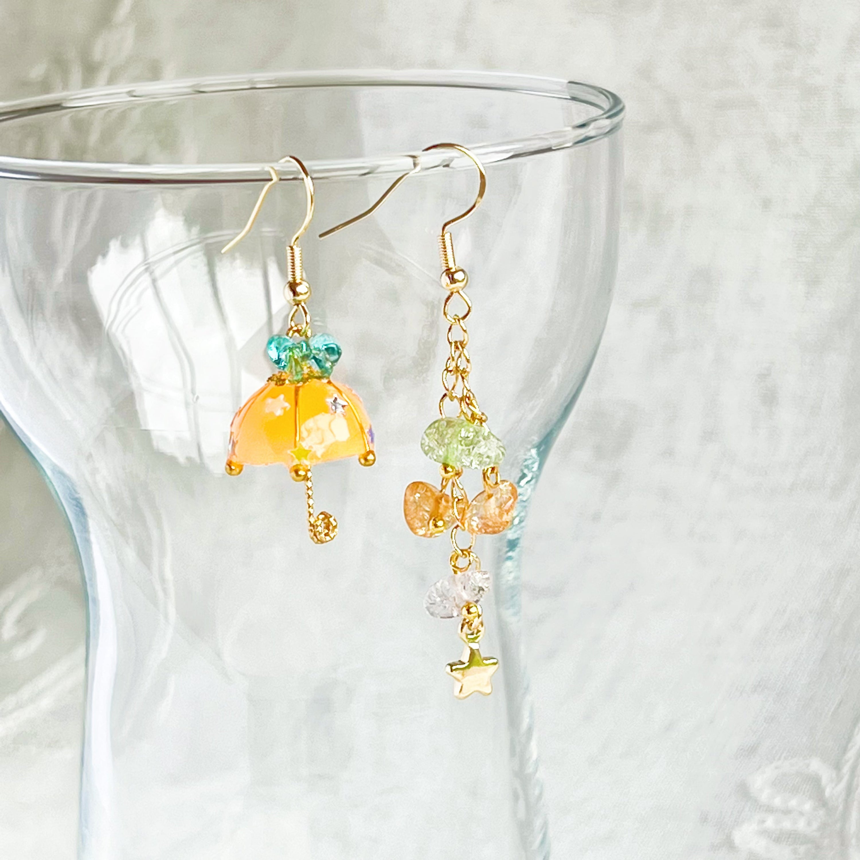 Colorful Orange with Blue Bow Umbrella earrings featuring rainbow stones, handmade with gold plated sterling silver ear wires.
