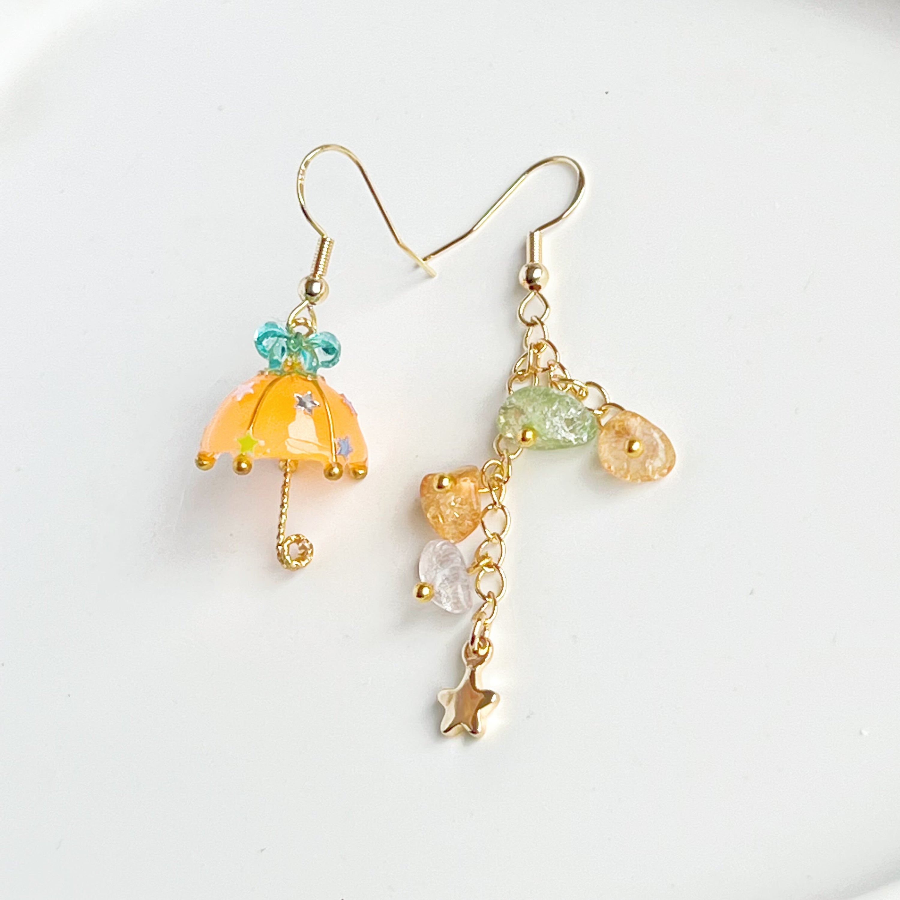 Colorful Orange with Blue Bow Umbrella earrings featuring rainbow stones, handmade with gold plated sterling silver ear wires.