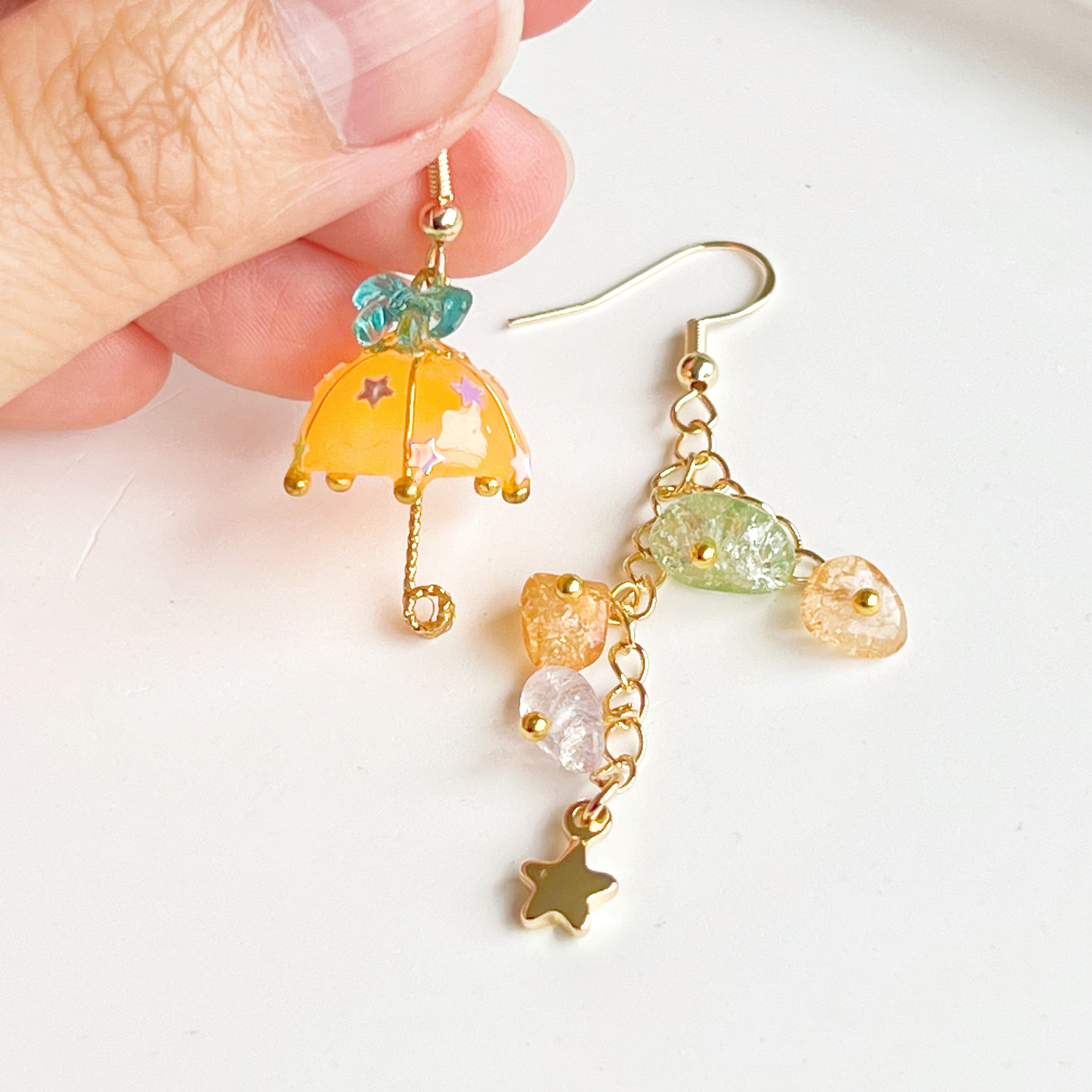 Colorful Orange with Blue Bow Umbrella earrings featuring rainbow stones, handmade with gold plated sterling silver ear wires.
