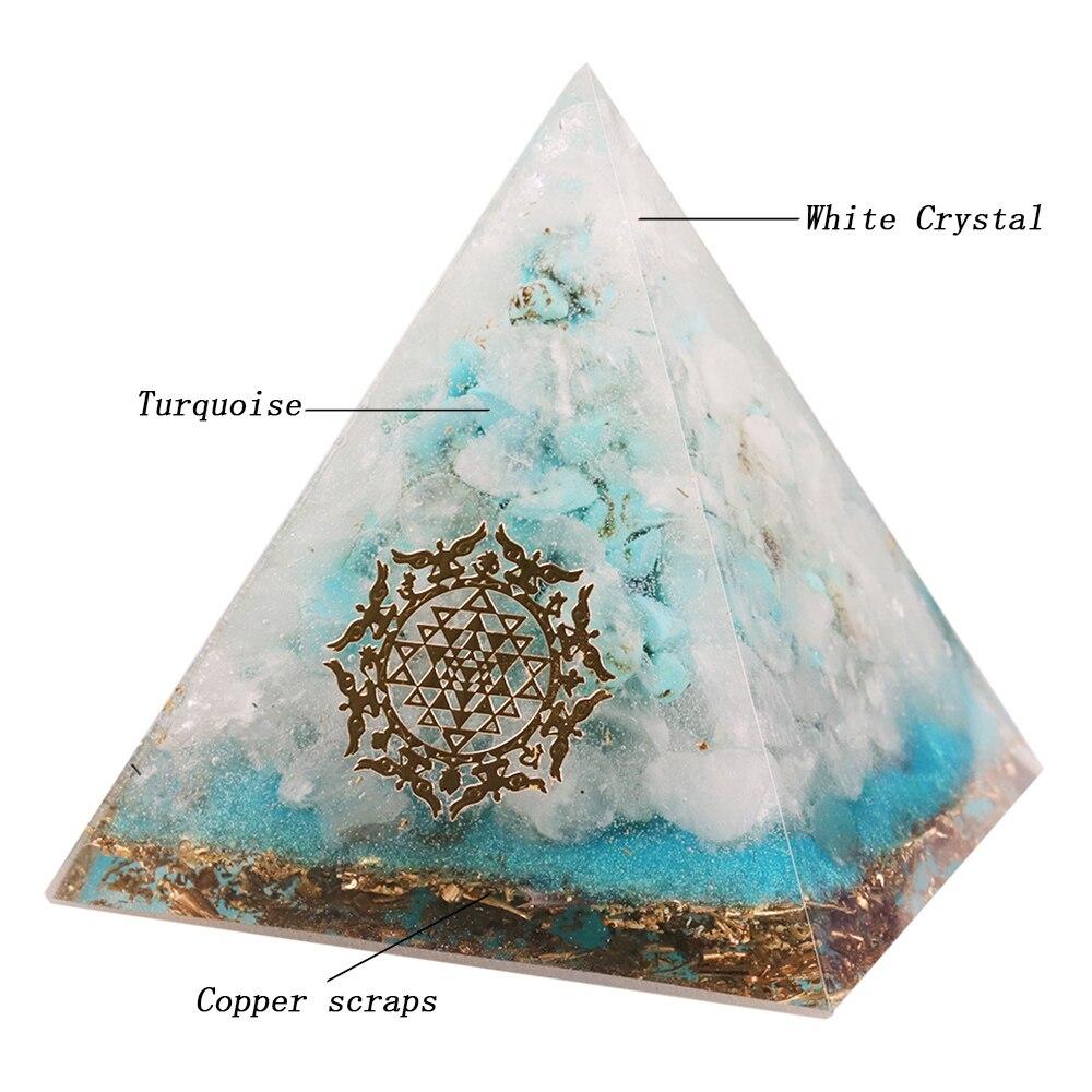 A handcrafted Orgone Crystal Gemstone Pyramid made of turquoise, white crystal, and copper scraps, designed for energy generation and home decor.