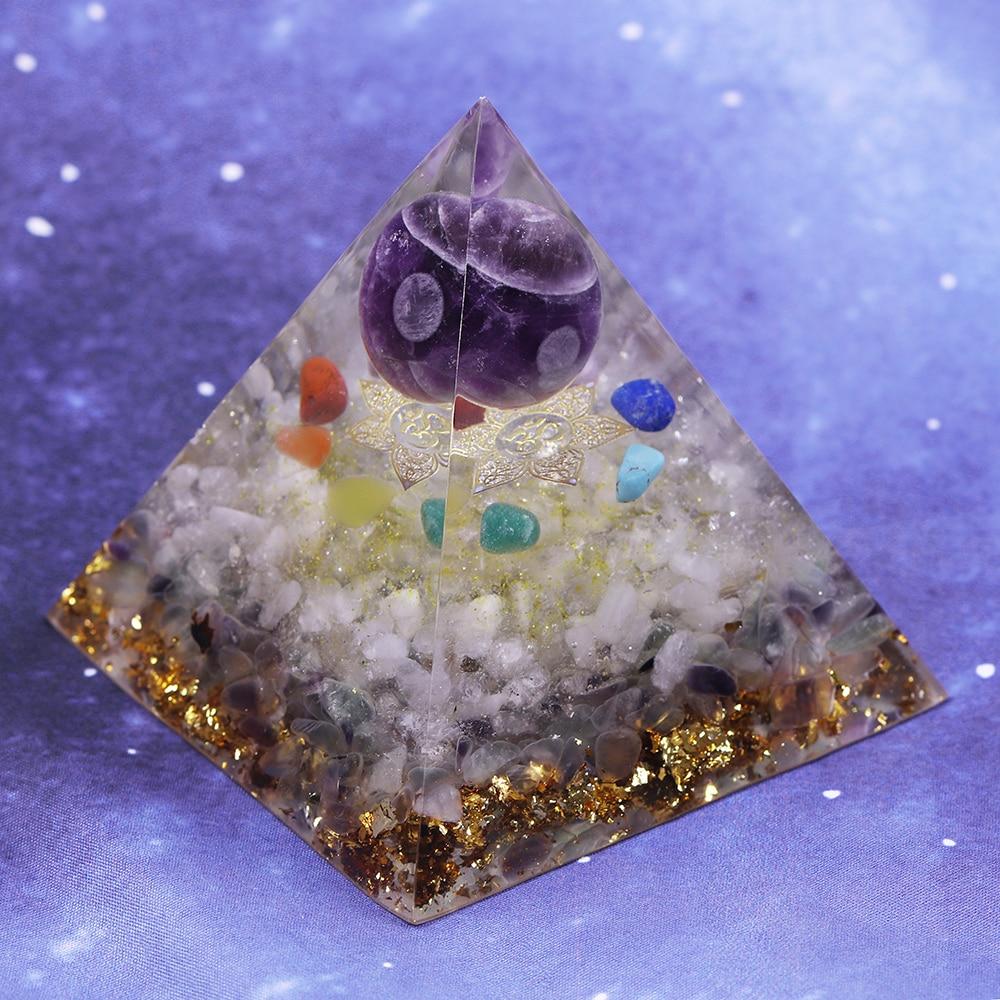 A beautifully handcrafted Orgonite Amethyst Pyramid featuring natural stones like amethyst and fluorite, designed to enhance energy flow.