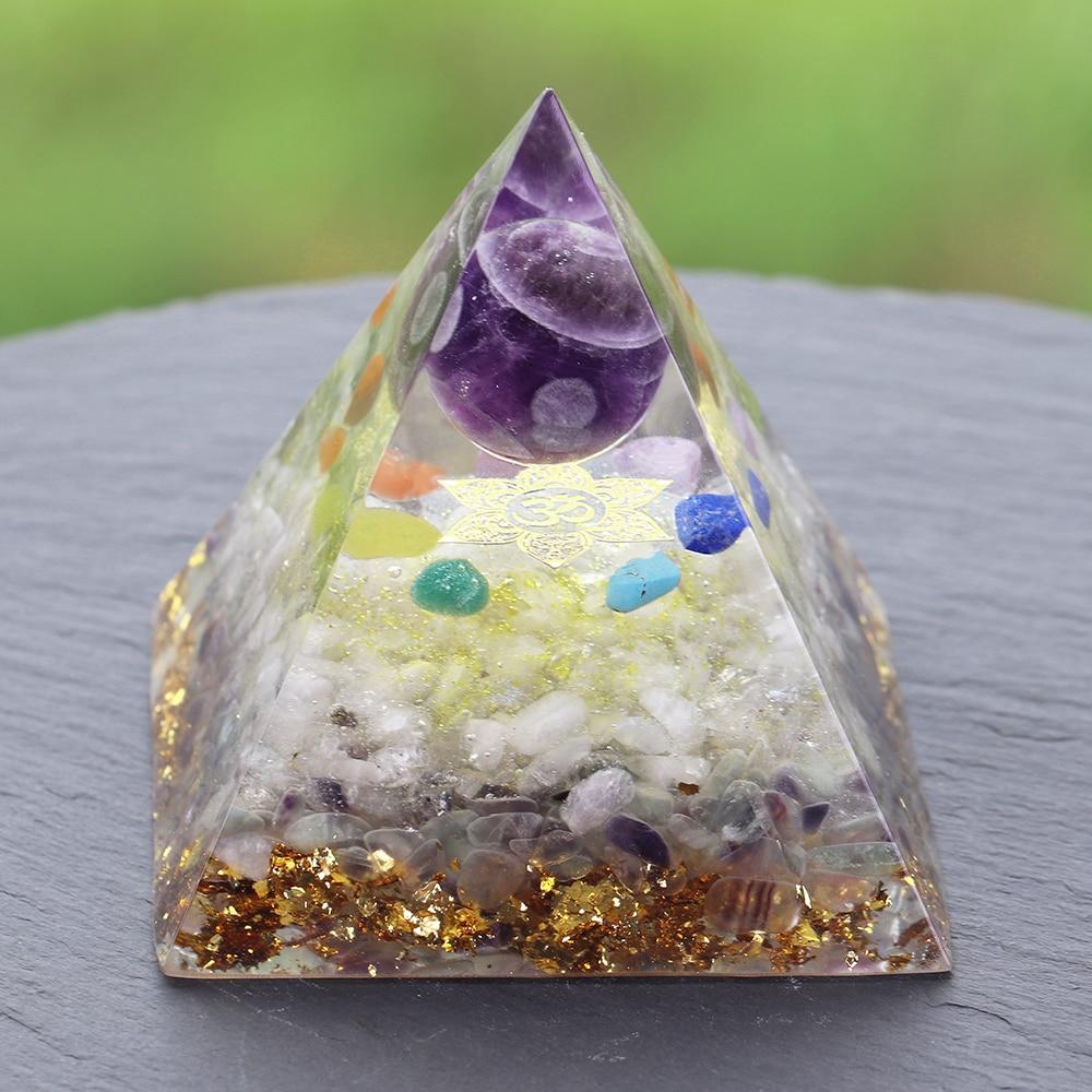 A beautifully handcrafted Orgonite Amethyst Pyramid featuring natural stones like amethyst and fluorite, designed to enhance energy flow.