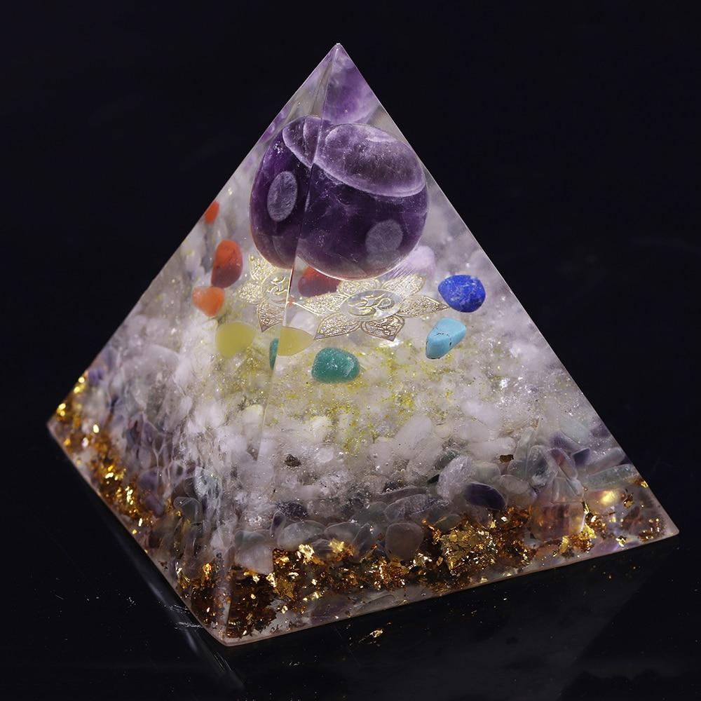 A beautifully handcrafted Orgonite Amethyst Pyramid featuring natural stones like amethyst and fluorite, designed to enhance energy flow.