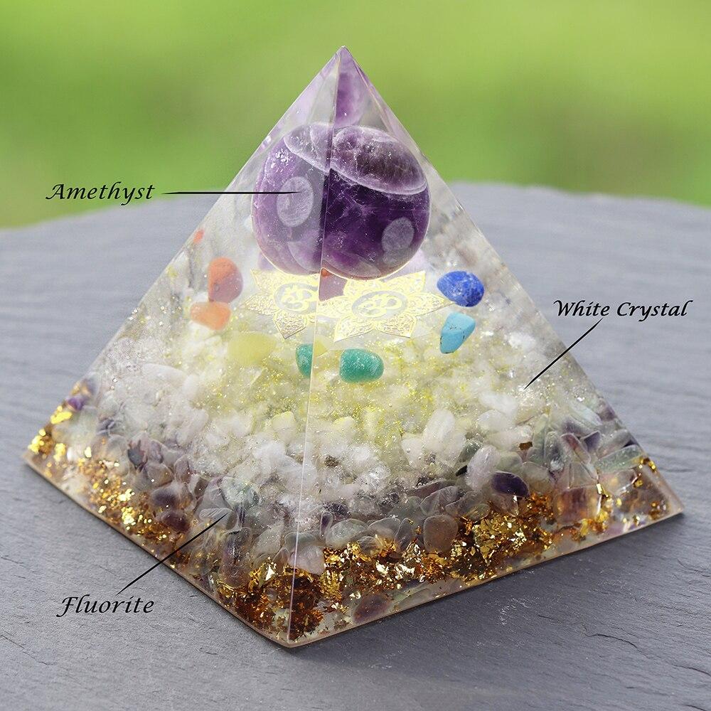 A beautifully handcrafted Orgonite Amethyst Pyramid featuring natural stones like amethyst and fluorite, designed to enhance energy flow.
