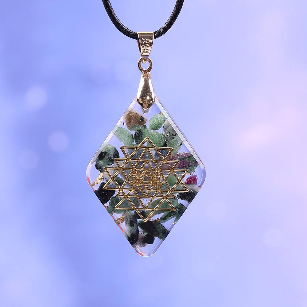 Handmade orgonite pendant featuring natural Epidote and gold foil in a geometric design, ideal for energy conversion and protection.