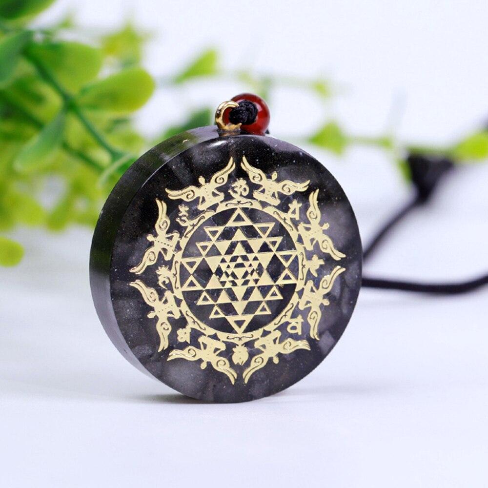 A stylish Orgonite Pendant Necklace featuring a geometric design made from luminous stone, copper, and resin, perfect for EMF protection.