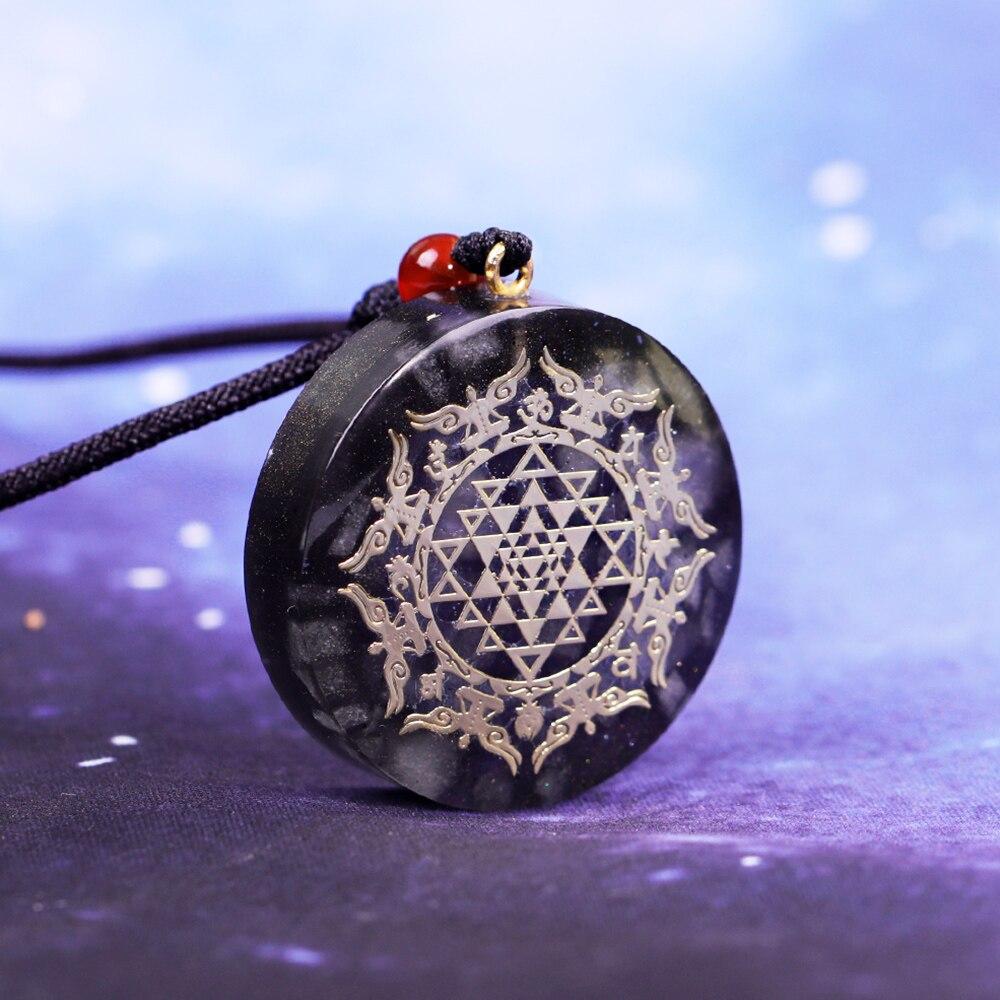 A stylish Orgonite Pendant Necklace featuring a geometric design made from luminous stone, copper, and resin, perfect for EMF protection.