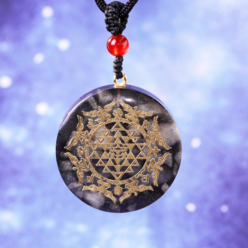 A stylish Orgonite Pendant Necklace featuring a geometric design made from luminous stone, copper, and resin, perfect for EMF protection.