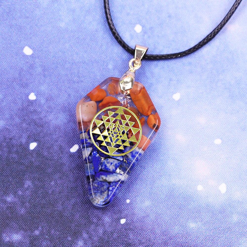 A beautifully crafted Orgonite Pendant featuring the Sri Yantra design, made from resin, southern red agate, lapis lazuli, and copper, hanging on a trendy rope chain.