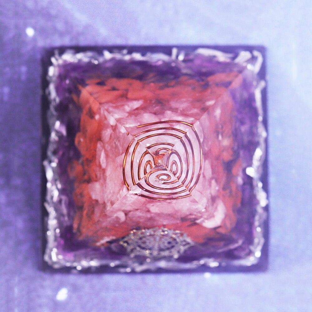 A beautifully crafted Orgonite Pyramid featuring amethyst, rose quartz, and copper, designed for positive energy and EMF protection.