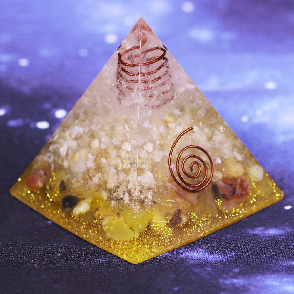 A beautifully crafted Orgonite Pyramid made from natural stones, resin, and copper, designed to enhance energy flow and attract positive vibrations.