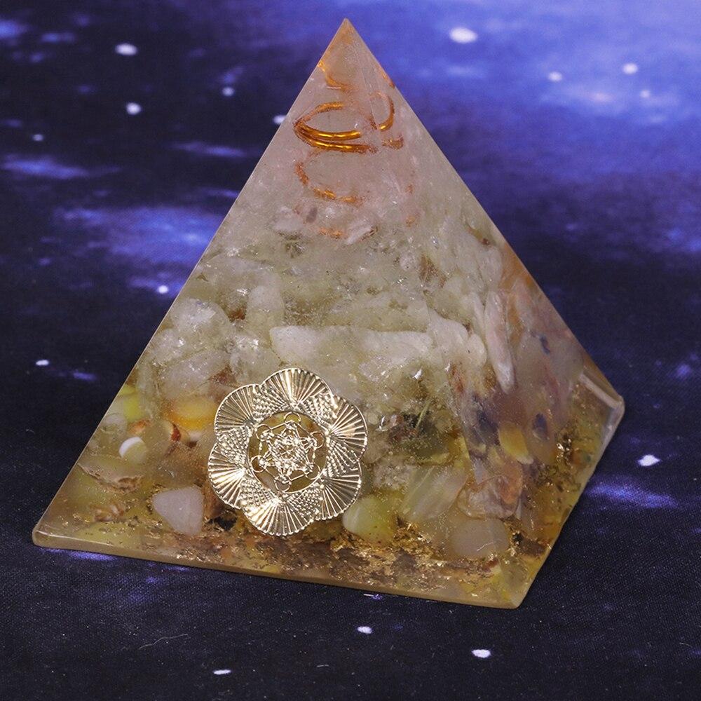 A beautifully handcrafted Orgonite Pyramid made from natural stones, resin, and copper, designed for EMF protection and chakra healing.