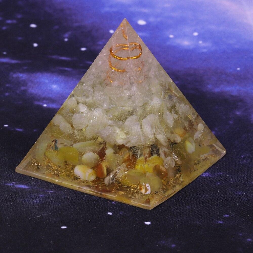 A beautifully handcrafted Orgonite Pyramid made from natural stones, resin, and copper, designed for EMF protection and chakra healing.