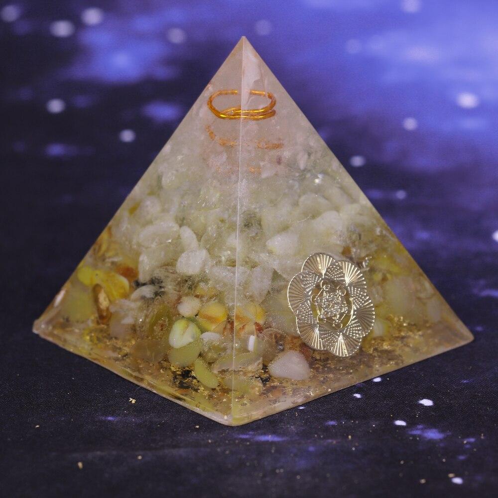 A beautifully handcrafted Orgonite Pyramid made from natural stones, resin, and copper, designed for EMF protection and chakra healing.
