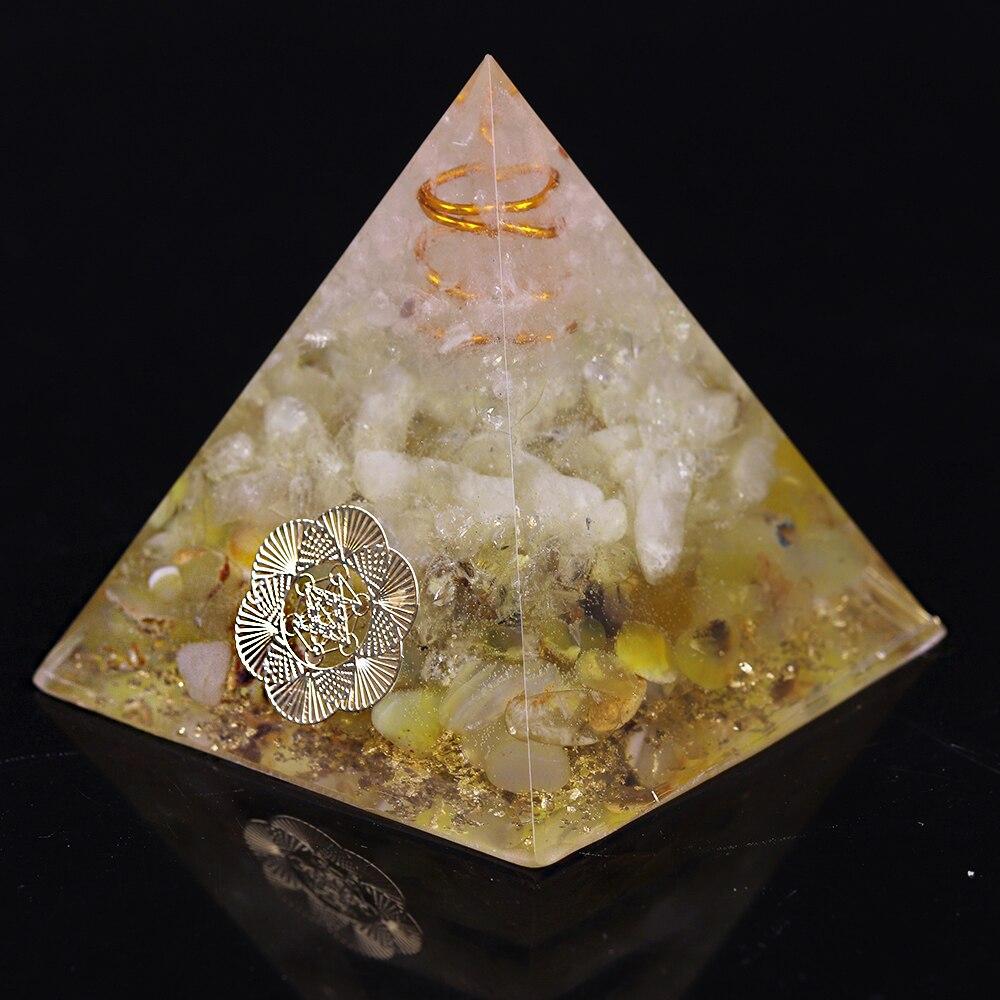 A beautifully handcrafted Orgonite Pyramid made from natural stones, resin, and copper, designed for EMF protection and chakra healing.