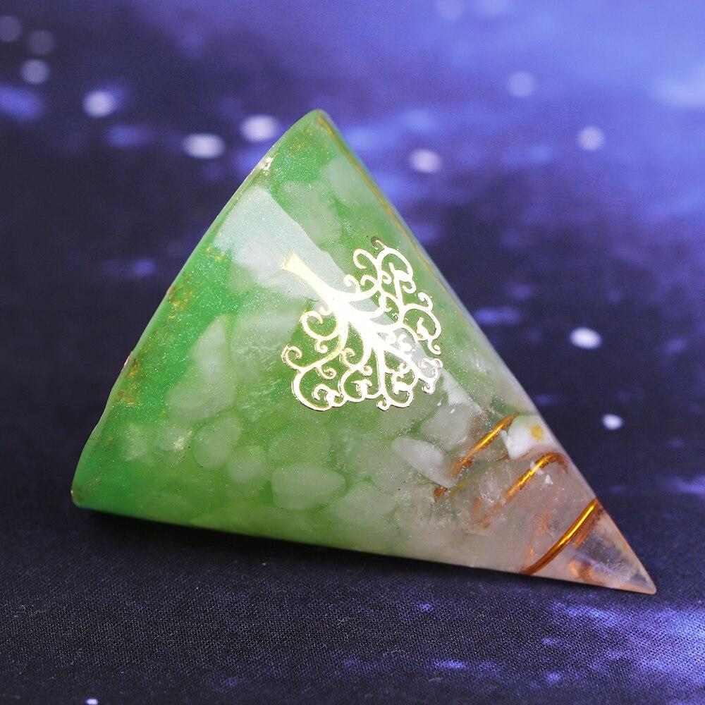 Orgonite Pyramid made of natural white crystal, resin, copper, and gold foil, designed for EMF protection and chakra healing.