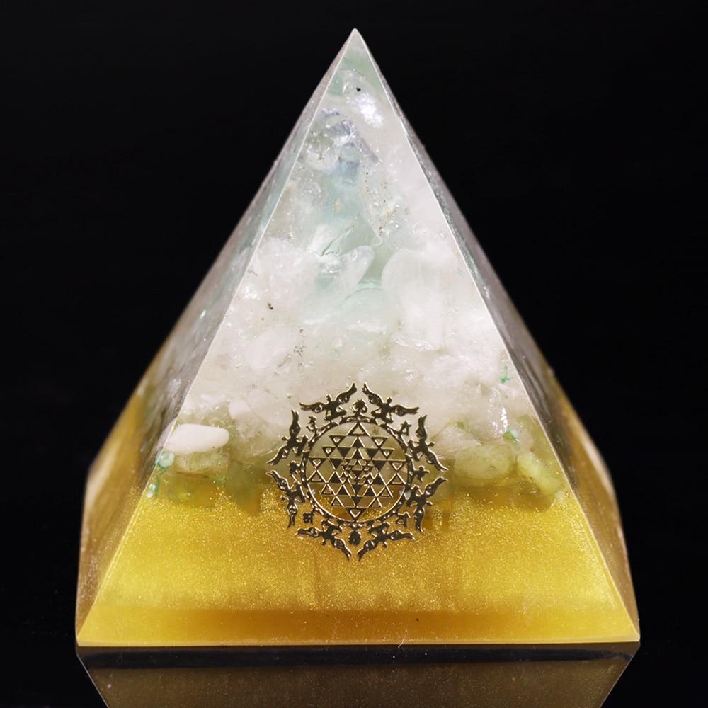 A handcrafted orgonite pyramid made from natural fluorite and resin, showcasing its vibrant colors and unique design.