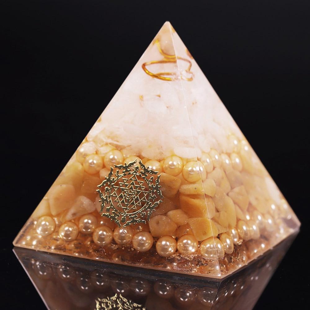Handcrafted Orgonite Pyramid made of white crystal, pearl, copper, and gold foil, designed for energy healing and chakra balancing.