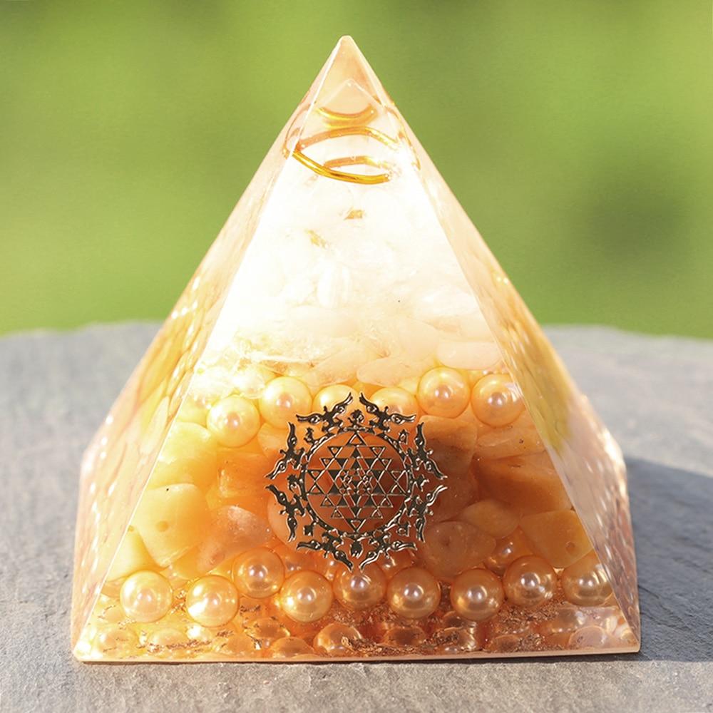 Handcrafted Orgonite Pyramid made of white crystal, pearl, copper, and gold foil, designed for energy healing and chakra balancing.