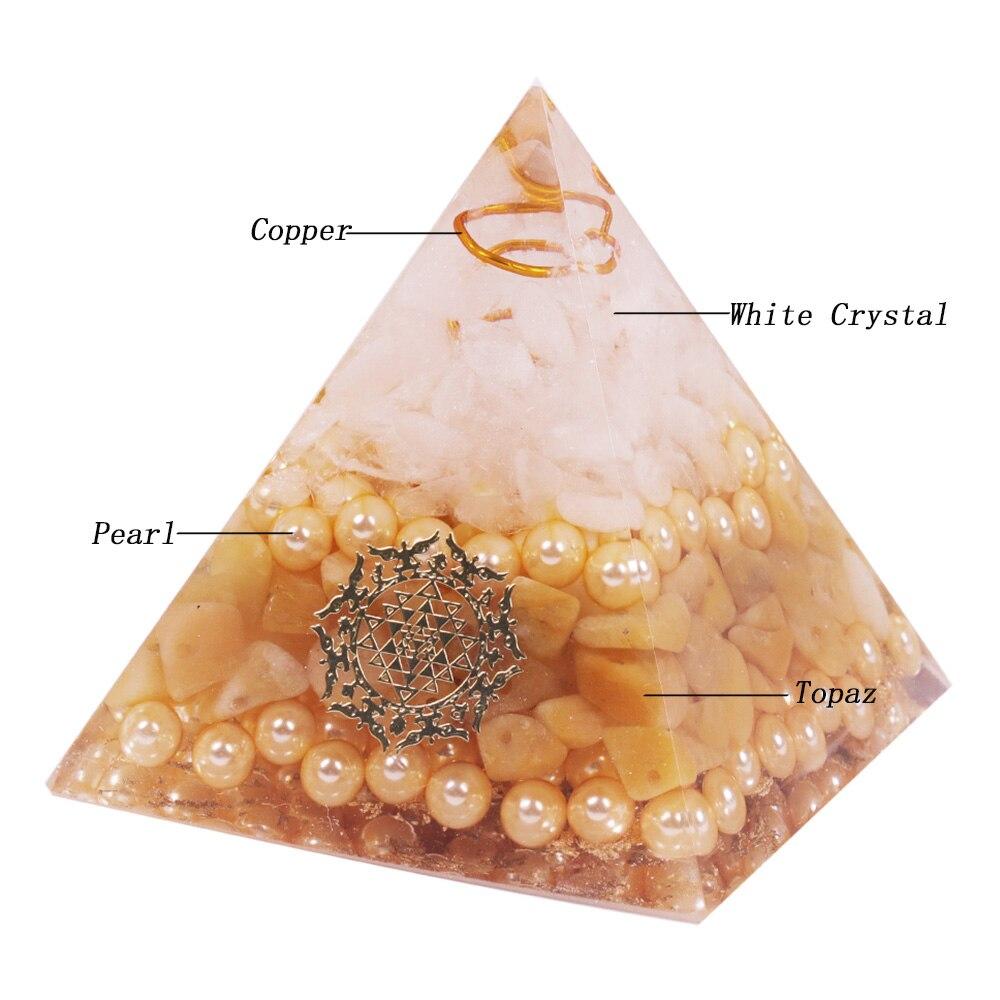 Handcrafted Orgonite Pyramid made of white crystal, pearl, copper, and gold foil, designed for energy healing and chakra balancing.