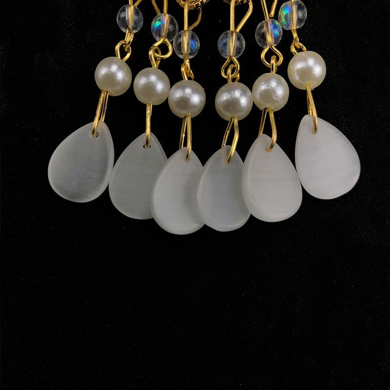 Elegant Oriental Shell Pearl Flower Hair Clip with tassels, showcasing intricate design and high-quality materials.