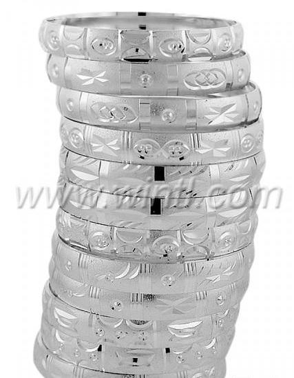 A set of Oro Laminado Tri-Gold Filled Bangles featuring diamond cut patterns, showcasing their elegant design and solid construction.