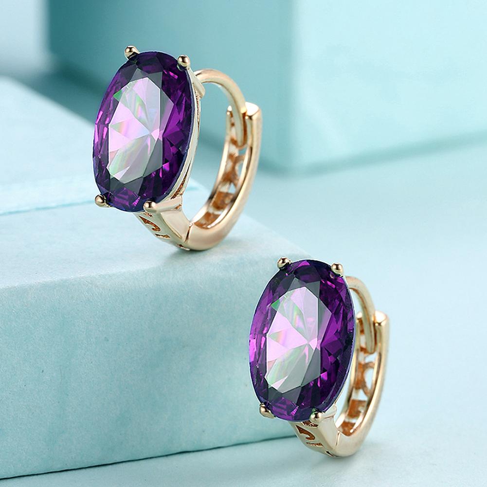 Elegant oval cut purple clip-on earrings in 14K gold, featuring certified crystals and a hypoallergenic design.