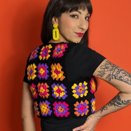 A pair of stylish oval drop earrings made from laser-cut acrylic, showcasing their elegant design and available colors.