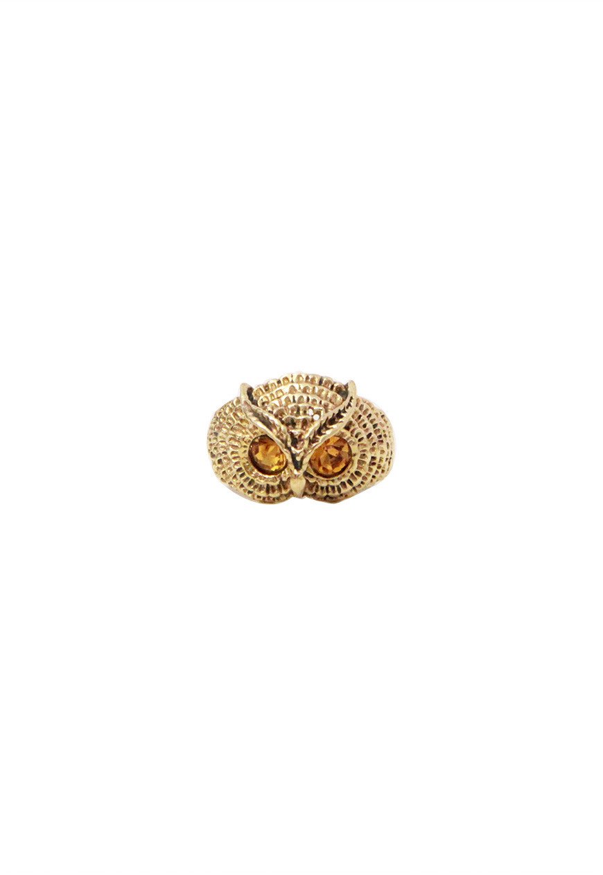 A beautifully crafted owl ring featuring a semi precious stone, available in gold and silver finishes, perfect for animal lovers.